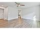 Expansive bedroom featuring wood flooring, neutral walls, and abundant natural light at 135 Eastmark Way, Fayetteville, GA 30214