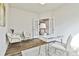 Bright home office featuring a modern desk, stylish chairs, and beautiful French doors at 135 Eastmark Way, Fayetteville, GA 30214