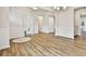 Bright living room with hardwood floors, white trim, and a doorway to another room at 135 Eastmark Way, Fayetteville, GA 30214