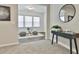 Sitting room featuring a front entry table and a large window with seating area at 135 Eastmark Way, Fayetteville, GA 30214