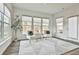 Inviting sun room with lots of light, modern decor, and comfortable seating at 135 Eastmark Way, Fayetteville, GA 30214