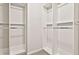 A large walk-in closet with customizable shelving and a modern design at 135 Eastmark Way, Fayetteville, GA 30214