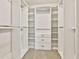 A spacious walk-in closet with custom shelving and ample storage space at 135 Eastmark Way, Fayetteville, GA 30214