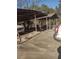 A rustic wooden carport offers covered parking and storage for vehicles and equipment at 4031 Old Fairburn Rd, Atlanta, GA 30349