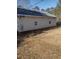 A view from the side yard of the house and surrounding property at 4031 Old Fairburn Rd, Atlanta, GA 30349
