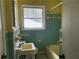 Bathroom with tiled walls and a combined shower and tub at 70 Rockmart Nw Dr, Atlanta, GA 30314
