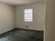 Simple bedroom with neutral walls and one window providing natural light at 70 Rockmart Nw Dr, Atlanta, GA 30314