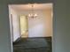 Dining room with chandelier and view into the living room and kitchen at 70 Rockmart Nw Dr, Atlanta, GA 30314
