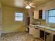 Functional kitchen with laminate countertops, white cabinets, and a window at 70 Rockmart Nw Dr, Atlanta, GA 30314