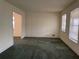 Spacious living room with neutral walls and natural light from two windows at 70 Rockmart Nw Dr, Atlanta, GA 30314