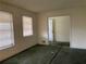 Living room featuring neutral walls and two windows letting in natural light at 70 Rockmart Nw Dr, Atlanta, GA 30314