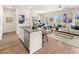 Open-concept living area features modern kitchen, dining space, and stylish living room at 1330 Magnolia Bend Way # 306, Jonesboro, GA 30238