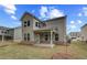 Spacious, well-maintained backyard, neutral siding, large windows and a covered patio, perfect for outdoor relaxation at 250 Arnewood Cir, Mcdonough, GA 30253