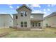 Backyard featuring lush green grass, patio, and exterior of the home at 250 Arnewood Cir, Mcdonough, GA 30253