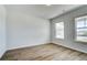 Inviting bedroom with natural light, hardwood floors, and neutral paint, ready for your personal touch at 250 Arnewood Cir, Mcdonough, GA 30253