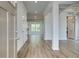 Bright entryway boasts hardwood floors, elegant trim, and an open floor plan leading to other rooms at 250 Arnewood Cir, Mcdonough, GA 30253