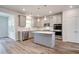 Modern kitchen equipped with stainless steel appliances, a center island, and sleek gray cabinetry at 250 Arnewood Cir, Mcdonough, GA 30253