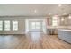 Spacious living area connected to a modern kitchen, offering abundant natural light and seamless flow at 250 Arnewood Cir, Mcdonough, GA 30253