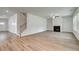 Spacious living room featuring a fireplace, hardwood floors, and staircase to the upper level at 250 Arnewood Cir, Mcdonough, GA 30253