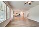 Bright open floorplan with windows, connecting living room to kitchen with a kitchen island at 250 Arnewood Cir, Mcdonough, GA 30253