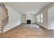 Bright living room featuring a fireplace and staircase to the upper level of the home at 250 Arnewood Cir, Mcdonough, GA 30253