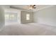 Spacious main bedroom with large windows and neutral walls and carpet at 250 Arnewood Cir, Mcdonough, GA 30253