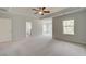 Large main bedroom boasting a trey ceiling, windows, and neutral decor at 250 Arnewood Cir, Mcdonough, GA 30253