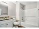 Well-lit bathroom featuring a tub, toilet, vanity, and granite countertop at 2549 Greenville Way, Decatur, GA 30034