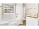 Bright bathroom with a soaking tub, separate shower and granite vanity at 2549 Greenville Way, Decatur, GA 30034