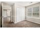 Neutral bedroom with closet, window, and doorway access to the rest of the house at 2549 Greenville Way, Decatur, GA 30034