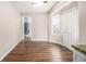 Bright breakfast nook featuring hardwood floors and access to back entrance at 2549 Greenville Way, Decatur, GA 30034