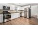 Bright and modern kitchen with granite countertops and stainless steel appliances at 2549 Greenville Way, Decatur, GA 30034