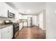 Bright and modern kitchen with granite countertops and stainless steel appliances at 2549 Greenville Way, Decatur, GA 30034