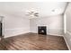Spacious living room with fireplace, ceiling fan and attractive hardwood floors at 2549 Greenville Way, Decatur, GA 30034