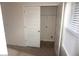 Bright closet with white doors, shelving, and ample space for storage at 2139 Theberton Trl, Locust Grove, GA 30248