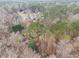 Aerial view of a home in a wooded neighborhood at 620 Bell Se Rd, Conyers, GA 30094