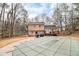 Backyard featuring inground pool with cover, two story home, deck and mature trees at 620 Bell Se Rd, Conyers, GA 30094