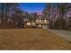 Charming two-story brick home with a well-maintained front yard and an attached single car garage at 620 Bell Se Rd, Conyers, GA 30094