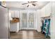 The kitchen features white cabinets, butcher block countertops, stainless steel appliances, and double doors to the deck at 620 Bell Se Rd, Conyers, GA 30094