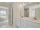 This bathroom showcases a dual sink vanity with modern lighting and ample counter space at 132 Felicity Pike, Locust Grove, GA 30248