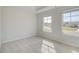 Cozy bedroom with carpet, two large windows, and light neutral walls at 132 Felicity Pike, Locust Grove, GA 30248