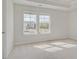 Bedroom with carpet, two bright windows, and neutral walls at 132 Felicity Pike, Locust Grove, GA 30248