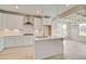 Bright kitchen area features an island and open access to dining area at 132 Felicity Pike, Locust Grove, GA 30248
