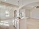 Open kitchen features an island and a view to the dining and living areas at 132 Felicity Pike, Locust Grove, GA 30248