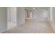 Spacious main bedroom with tray ceilings, a ceiling fan, and neutral carpeting offers relaxation and style at 132 Felicity Pike, Locust Grove, GA 30248
