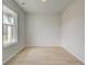 Bright, light-filled room features large window and hardwood floors at 132 Felicity Pike, Locust Grove, GA 30248