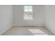 Walk-in closet with a window for natural light and wire shelving for efficient storage at 132 Felicity Pike, Locust Grove, GA 30248