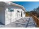 Exterior of this home features a spacious gray stained back deck with white siding at 1771 Mount Vernon Rd, Atlanta, GA 30338