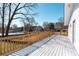 Large stained back deck with nice wood railing overlooks the landscaped backyard at 1771 Mount Vernon Rd, Atlanta, GA 30338