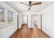 Bright bedroom boasts wood floors, ceiling fan, and convenient closet and doorway access at 1771 Mount Vernon Rd, Atlanta, GA 30338